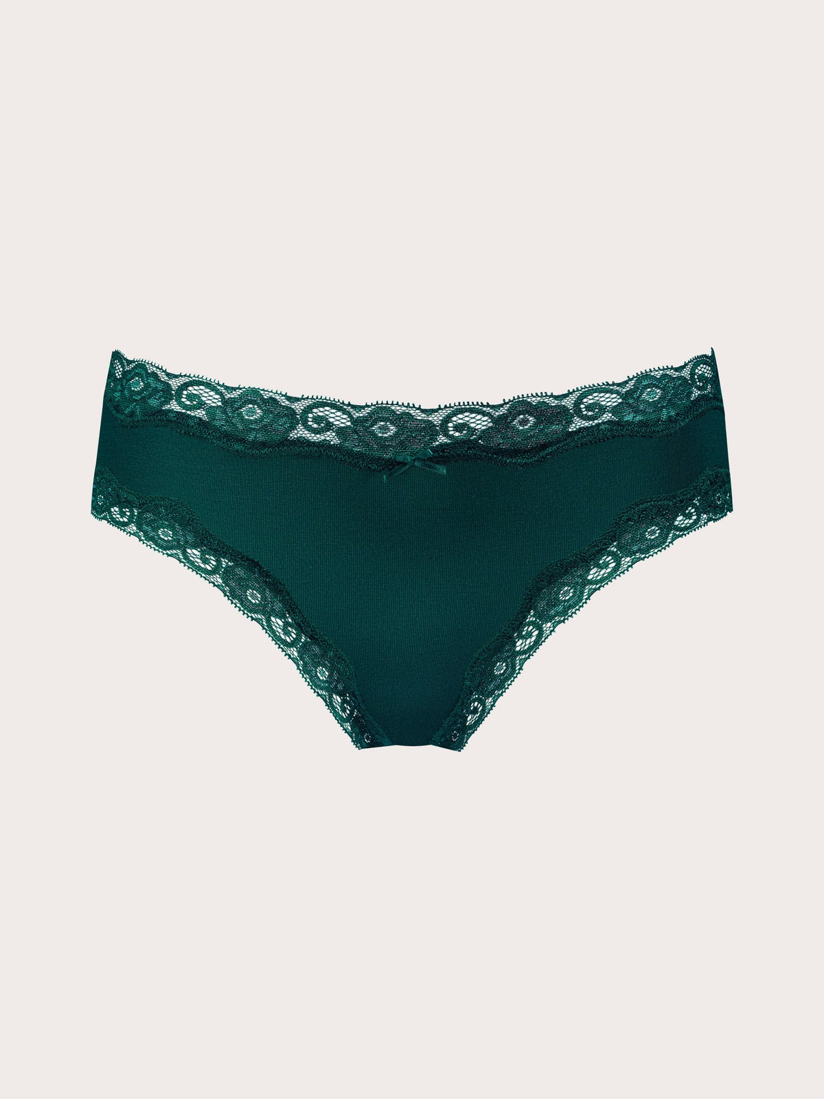 Dark green lace-trimmed underwear photographed flat against a light warm gray background.