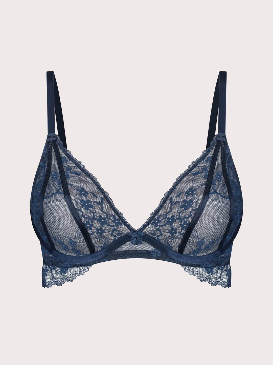 A navy blue lace underwire bra with thin shoulder straps and a delicate scalloped lace trim, displayed against a solid light beige background.